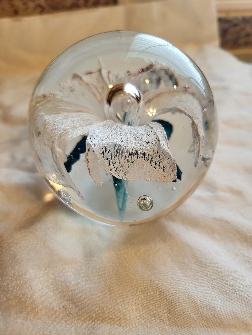 Handblown Glass Art 3 x 3 In. Sphere with White and Teal Floral Core Paperweight - Picture 4 of 10